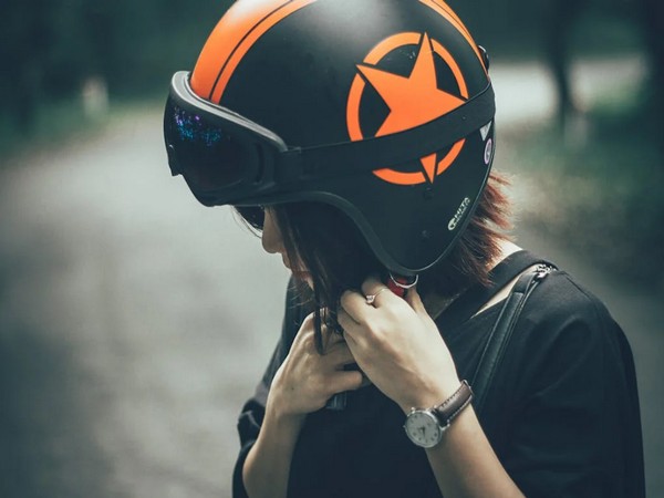 Two helmets mandatory and ABS system showcased on a modern Indian scooter for 2026 safety regulation